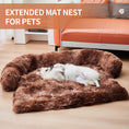 Cargar la imagen en la vista de la galería, White dog laying on brown extended plush pet mat nest with bolster beside orange couch