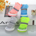 Cargar la imagen en la vista de la galería, Multiple dog booties in pink, blue, gray, and neon green knit colors arranged on white surface