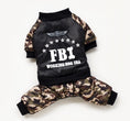 Load image into Gallery viewer, Black and camouflage FBI dog jumpsuit laid flat showing front design with ribbed cuffs and snap buttons