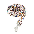 Load image into Gallery viewer, Rolled leopard print dog leash highlighting metal swivel clip