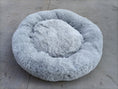 Load image into Gallery viewer, Light gray plush round pet bed on concrete surface showing fluffy texture