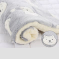 Load image into Gallery viewer, Rolled plush pet blanket with gray bear face pattern and warm cream fleece interior