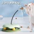 Load image into Gallery viewer, Cat playing with interactive treat toy featuring a green base, spring stem, and clear treat container