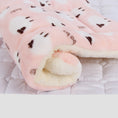 Load image into Gallery viewer, Rolled pet blanket in pale pink with white cartoon cat faces and fleece lining