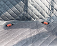 Cargar la imagen en la vista de la galería, Seat belt buckle openings on black quilted waterproof car seat cover