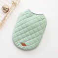 Charger l'image dans la visionneuse de la galerie, Light green quilted dog vest laid flat with diamond pattern and leather logo label