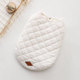 Charger l'image dans la visionneuse de la galerie, White quilted dog vest flat on surface showing clean stitching and brown leather tag