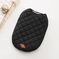 Charger l'image dans la visionneuse de la galerie, Black quilted dog vest laid flat showing diamond stitching and leather logo patch