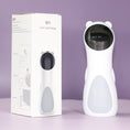 Load image into Gallery viewer, Laser cat toy placed next to its white packaging box on purple background