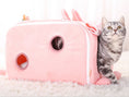 Load image into Gallery viewer, Grey tabby cat exiting pink rectangular bunny shaped cat nest with small circular openings
