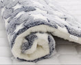 Load image into Gallery viewer, Close-up of plush star pattern pet blanket rolled with visible fleece edge