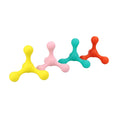 Load image into Gallery viewer, Four colorful dog chew toys lined up on white background