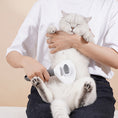 Load image into Gallery viewer, Person holding a white cat and grooming its belly with the detachable pet grooming brush