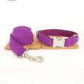 Load image into Gallery viewer, Matching purple velvet dog collar and leash with metal buckle and clasp on wood and white background.