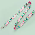 Load image into Gallery viewer, Floral patterned dog leash fully extended on green background
