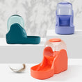 Load image into Gallery viewer, Three automatic pet feeder fountains in blue, purple, and orange colors displayed on platforms