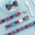 Load image into Gallery viewer, Colorful graffiti pattern dog collar, leash, and matching bow tie set laid on blue background