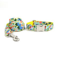 Load image into Gallery viewer, Rolled floral dog leash and matching collar set displayed on white background