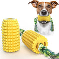 Load image into Gallery viewer, Yellow corn-shaped chew toy with attached rope and dog holding it