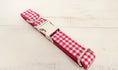 Load image into Gallery viewer, Full length of red and white checkered dog collar laid flat on white background