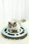 Load image into Gallery viewer, Cat resting on a round light blue corrugated paper scratcher with holes and ball