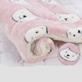 Load image into Gallery viewer, Rolled pink plush pet blanket with white bear faces and soft fleece lining