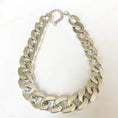 Load image into Gallery viewer, Big silver plastic chain necklace with adjustable clasp laying flat