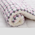 Load image into Gallery viewer, Rolled pet blanket with pink and white pebble pattern and thick fleece interior