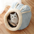 Load image into Gallery viewer, Soft gray and cream plush cat cave with large bunny ears, occupied by a gray and white cat inside, set on a wooden floor.