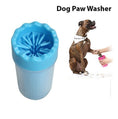 Load image into Gallery viewer, Blue silicone dog paw washer cup with a dog having paw cleaned using the washer