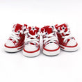 Load image into Gallery viewer, Four black and white star print dog shoes side by side showing front view with white laces