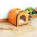 Load image into Gallery viewer, Orange plush pet kennel with yellow bear ears positioned on wooden floor
