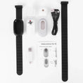 Load image into Gallery viewer, Unassembled white camera components laid out with collar, cables, and instructions