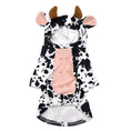 Cargar la imagen en la vista de la galería, Flat lay of the black and white spotted velvet cow costume for dogs with hood, ears, horns, and pink textured belly