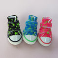 Cargar la imagen en la vista de la galería, Three dog sneakers lined up from front in black, blue, and pink colors with star patterns and rubber toe caps.