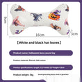 Charger l'image dans la visionneuse de la galerie, White Halloween bone toy featuring black witch hats and pumpkins, dimensions shown