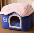 Cargar la imagen en la vista de la galería, Blue and pink plush pet house with rounded roof on brown surface