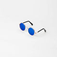 Load image into Gallery viewer, Pet sunglasses resting on soft surface showing lightweight rose gold frame