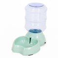 Cargar la imagen en la vista de la galería, Light green pet feeding station with transparent large water container and curved food bowl base on white background