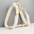 Load image into Gallery viewer, Close-up of detachable beige fabric flower decoration with gold bead center