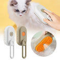 Cargar la imagen en la vista de la galería, Hand brushing a white long-haired cat with white electric spray massage pet brush, close-up of silicone bristles spraying liquid