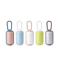 Load image into Gallery viewer, Lineup of five portable pet poop bag dispensers in different color combos: pink-blue, blue-white, pink-white, green-white, coffee