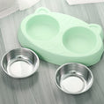 Load image into Gallery viewer, Empty mint green plastic base with two stainless steel bowls removed, displayed on gray surface