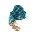 Load image into Gallery viewer, Rolled up blue tie-dye dog leash with gold metal clip