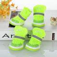 Cargar la imagen en la vista de la galería, Neon green knit dog booties with reflective strap and white sole on white display surface