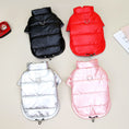 Charger l'image dans la visionneuse de la galerie, Four waterproof padded dog jackets displayed flat in black, red, silver, and pink colors with metal D-rings and adjustable drawstrings