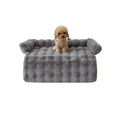 Load image into Gallery viewer, Small poodle sitting on gray plush dog mat with raised edges isolated on white background