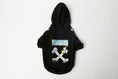 Load image into Gallery viewer, Laid flat black dog hoodie with hood and painterly graphic print on the back displayed on white background