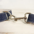 Load image into Gallery viewer, Close-up of metal clasp and denim leash stitching