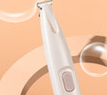 Load image into Gallery viewer, Close-up view of white pet trimmer showing power button and blade design